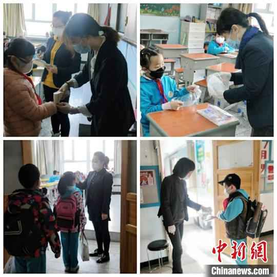 乌鲁木齐市第一小学开学第一天,老师们为学生测温。 李金艳 摄  新疆中小学和中职学校全面开学复课